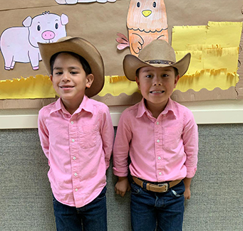 Two students dressed as farmers.