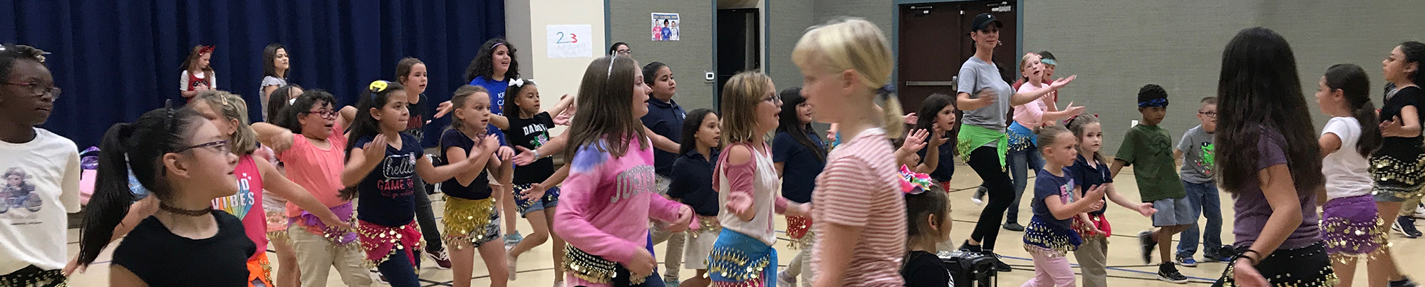 Many students dancing in a group